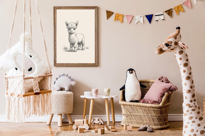 May include: A framed black and white line art drawing of an alpaca hanging on a wall above a children's room featuring a macrame swing, a woven rattan chair, a plush penguin, a tall giraffe stuffed animal, and a small wooden table.