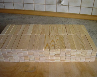 Wooden building blocks 120 x 24 x 8 mm made from local pine wood