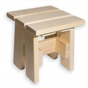 May include: A small, unfinished wooden stool with a rectangular seat composed of three parallel planks. The stool has four sturdy legs and a supporting structure beneath the seat. The natural wood color gives it a simple, rustic aesthetic.