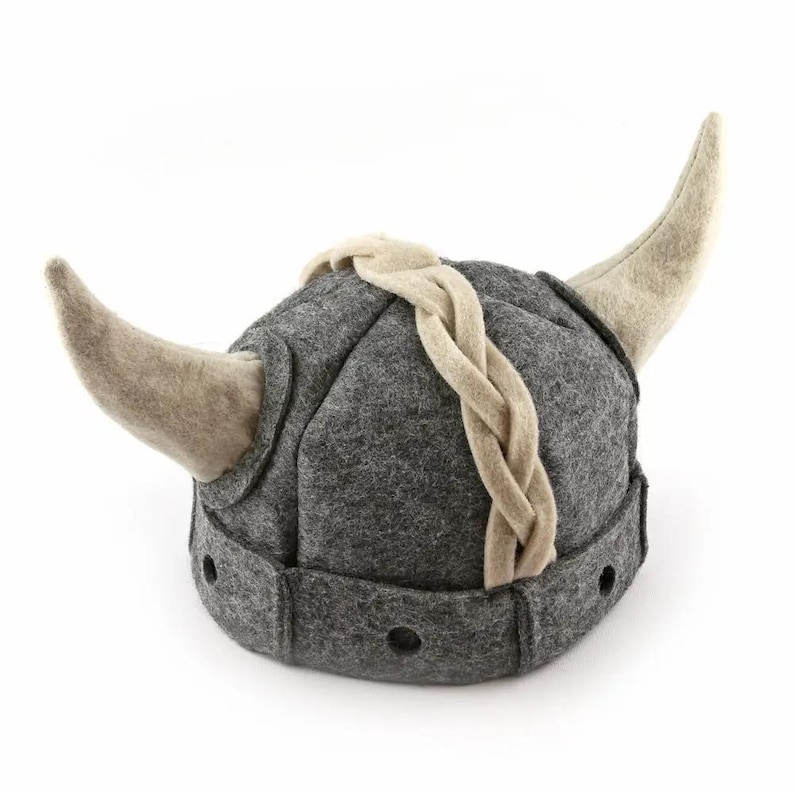May include: A gray felt Viking hat with a braided band and two horns. The hat has a pointed top and a rounded base.