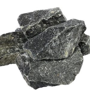 May include: A collection of rough, dark gray rocks with a textured surface. The rocks are piled together, showcasing their irregular shapes and varying sizes. The image is set against a plain white background.