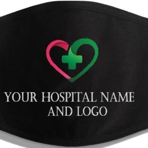 May include: Black face mask with a pink and green heart with a white plus sign in the center. The text "YOUR HOSPITAL NAME AND LOGO" is printed in white below the heart.