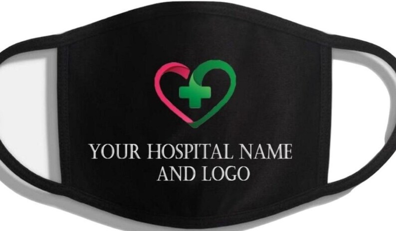 May include: Black face mask with a pink and green heart with a white plus sign in the center. The text "YOUR HOSPITAL NAME AND LOGO" is printed in white below the heart.