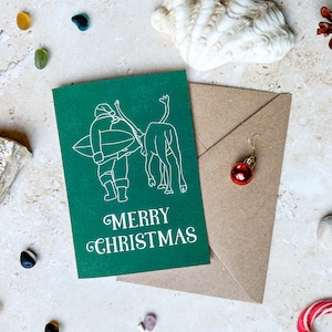 Cartão de felicitações de Natal do Papai Noel surfando