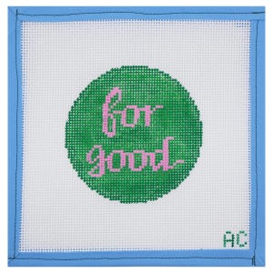 May include: Square needlepoint canvas with a white background, a green circle, and the words "for good" in pink. The canvas is framed with a light blue border.