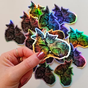Les chats. autocollant holographique