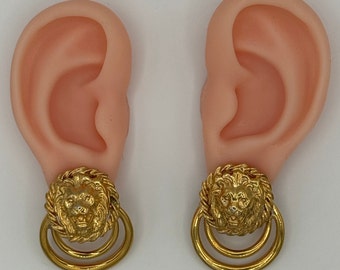 Vintage gold tone 3-D lion head earrings.