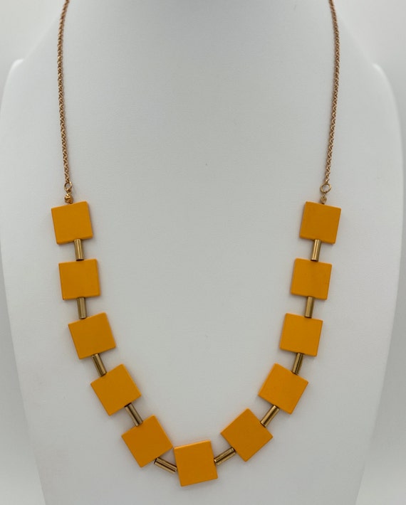 Long gold tone yellow and square, metal bead neckl