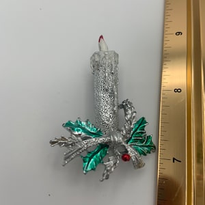 Vintage designer Gerry’s non magnetic candle brooch.