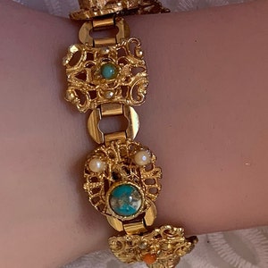Vintage fancy gold color tone and small variety of stones.