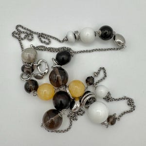 Labeled “Steel” silver tone chain necklace with acrylic beads