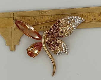 gold tone  and amber tone rhinestones and crystal dragonfly brooch.