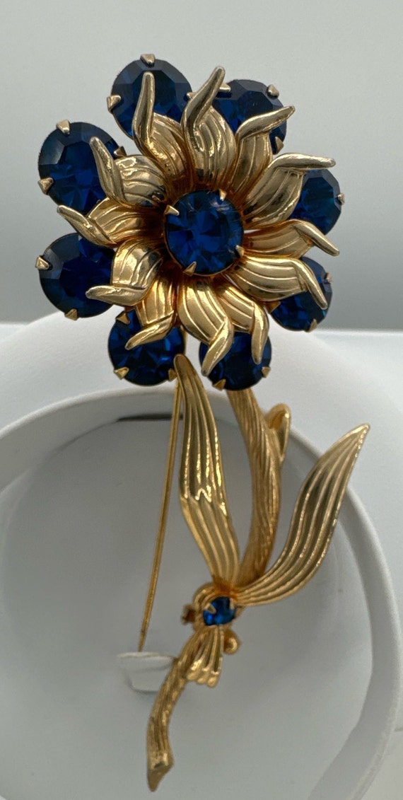 Beautiful blue rhinestones  gold tone flower brooc
