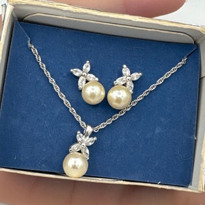 Vintage Avon silver plated white faux pearl  and clear rhinestones set of earrings and necklace.