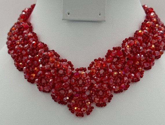 Red beaded necklace gold tone fold over closure. - image 1