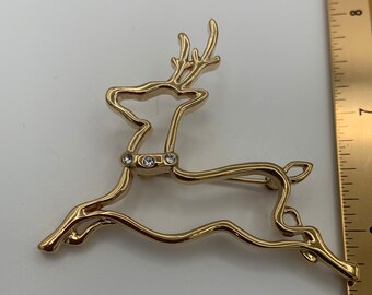 Adorable Christmas reindeer brooch with three clear rhinestones on collar