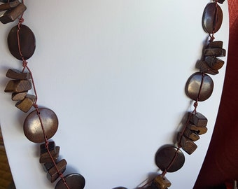 Vintage dark brown smooth Woden disks and chunky smaller pieces necklace.