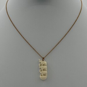 Possible bone/celluloid carved elephant necklace, 14k gold filled chain necklace.