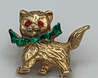 Cute Christmas kitten with green enamel bow