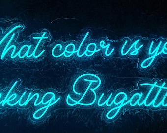 May include: A bright cyan neon sign featuring the text "What color is your fucking Bugatti ??" in a cursive script font. The glowing letters are arranged in two lines against a dark background, creating a vibrant and luminous display.