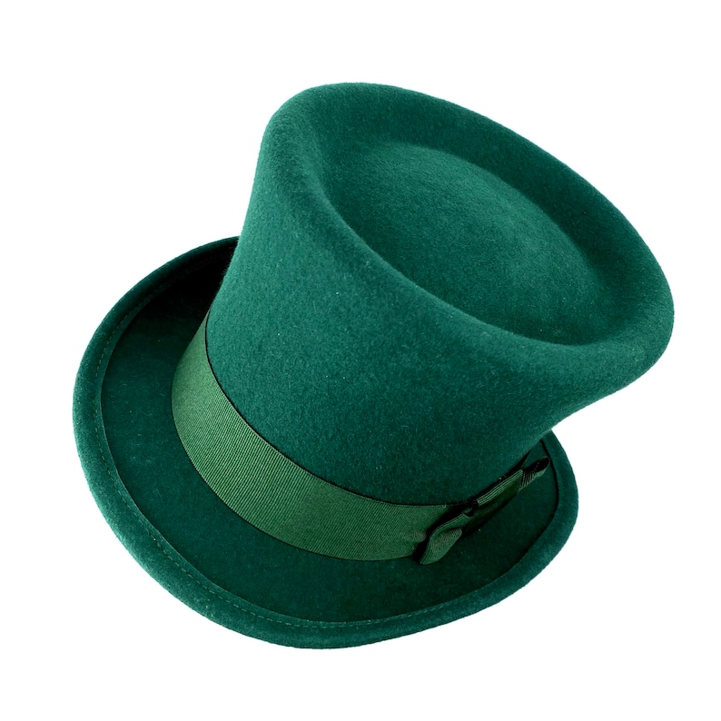 May include: A dark green felt top hat with a wide brim and a matching green ribbon.