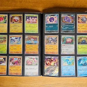May include: A binder filled with Pokemon trading cards. The cards are organized in rows and columns, and each card features a different Pokemon character. The cards are in various colors, including red, blue, green, and yellow.