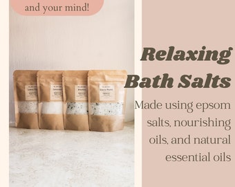 May include: Four brown paper bags filled with white bath salts. Each bag has a label with a different scent: Lemon & Pine, Lavender,  Brewed Tea, and Citrus Burst. The text "Relaxing Bath Salts" is written in brown text on a light pink background. The text below reads "Made using epsom salts, nourishing oils, and natural essential oils."