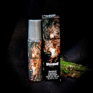 May include: A roll-on perfume bottle and box featuring a werewolf design. The bottle and box have a dark background with the word "Werewolf" and "Mystical Perfume Collection" printed on the box. The bottle contains 0.33 fl oz.