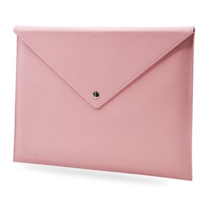 May include: A pale pink leather envelope clutch with a silver button closure.