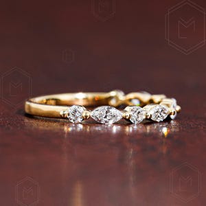 Elegant lab grown diamond wedding band featuring alternating marquise and round stones in a 2mm band