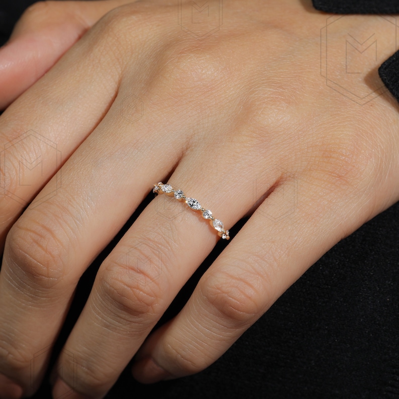 Minimalist 2mm lab grown diamond anniversary band with marquise and round cut alternating gemstones