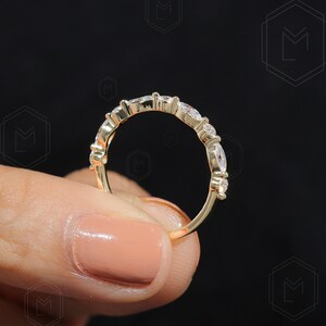Women's lab grown wedding band with marquise and round cut diamonds in a slim half eternity style