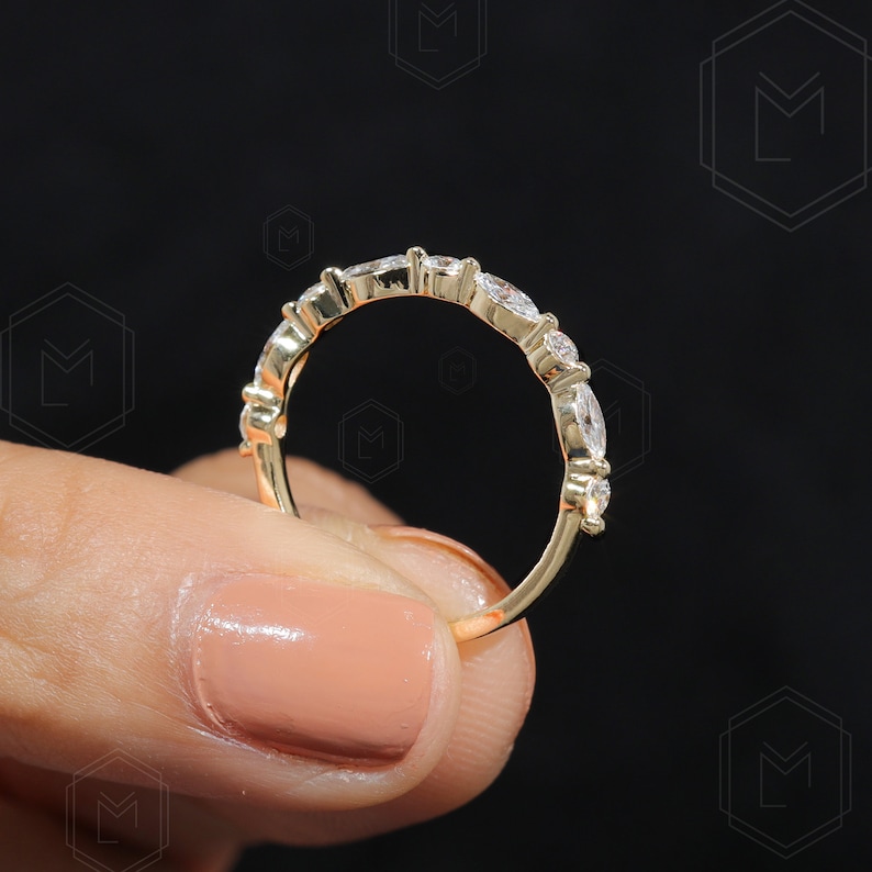 Women's lab grown wedding band with marquise and round cut diamonds in a slim half eternity style