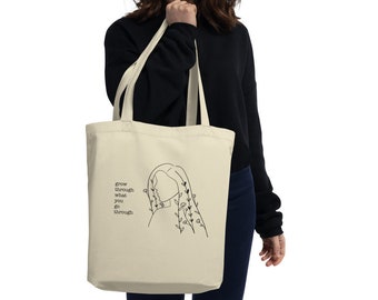 Crecer a través de lo que pasas por Tote Bag