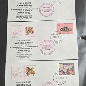 May include: Three white commemorative envelopes from the Republic of China Stamp Exhibition in Australia, 1982. Each envelope features a postage stamp, a circular Taipei postmark, and text detailing the exhibition in Melbourne, Brisbane, and Sydney.