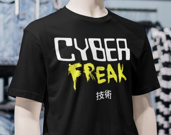 May include: A black t-shirt with a white graphic that says "CYBER FREAK" in a yellow and white dripping paint style. The text "技術" is printed below the graphic in black.