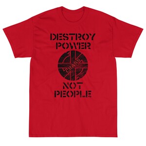 May include: Red t-shirt with a black graphic that says "DESTROY POWER" and features a circle with a symbol inside and the word "CRASS" written inside the circle. The graphic also says "NOT PEOPLE" underneath the circle.