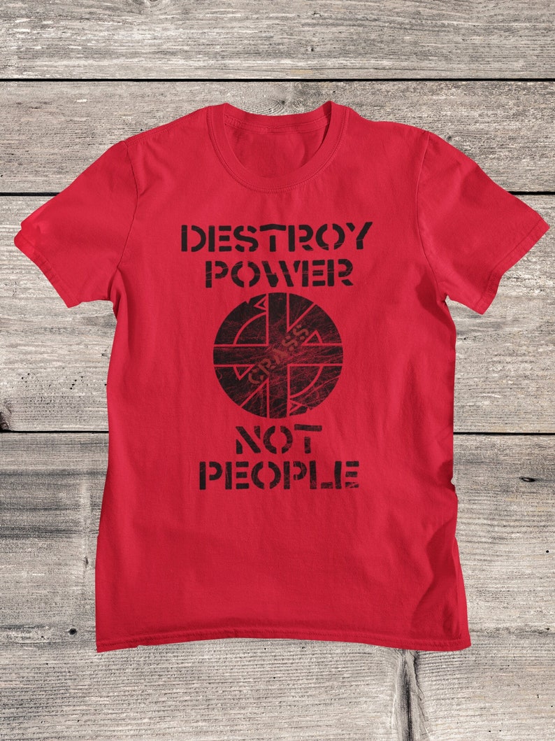 May include: Red t-shirt with a black graphic that says "Destroy Power" and features a circle with a symbol inside. The text "Not People" is below the circle.