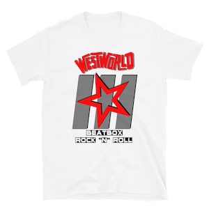 May include: White t-shirt with a red and gray graphic design. The graphic features the text "Westworld" in red, three gray stripes, a red star, and the text "Beatbox Rock 'n' Roll" in black.