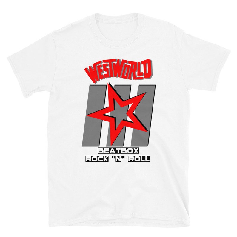 May include: White t-shirt with a red and gray graphic design. The graphic features the text "Westworld" in red, three gray stripes, a red star, and the text "Beatbox Rock 'n' Roll" in black.