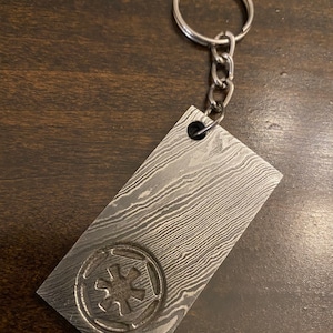 Damascus Beskar ingot keychain prop replica from Mandalorian. Stamped empire symbol