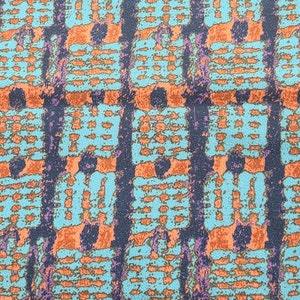 May include: Abstract textile pattern featuring a repeating design of teal, orange, purple, and navy blue. The pattern consists of rectangular shapes and vertical lines, creating a textured appearance. The color palette is vibrant and eye-catching.