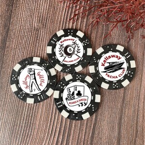 May include: Four round black and white poker chips featuring custom graphics. One shows a golfer with text Kellaway Golf Club, one an 8-ball with Kellaway Billard Club, one a yacht with Kellaway Yacha Club, and one playing cards with Ricardo & Vanessa.