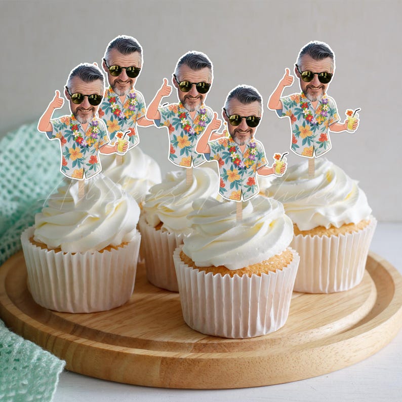 May include: A set of four cupcake toppers featuring a cartoon illustration of a person with a beard, wearing black sunglasses and a floral print shirt, giving a thumbs up while holding a yellow drink with a straw, attached to wooden sticks.