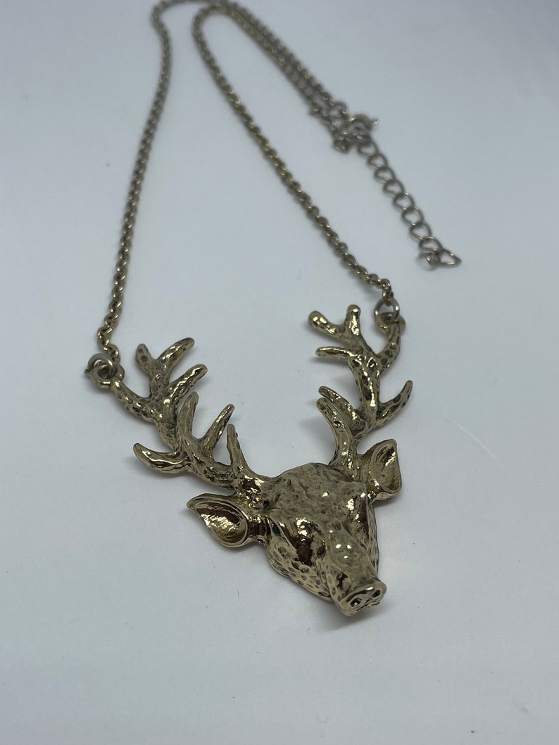 reindeer necklace with blue crystal drop Silver tone stag