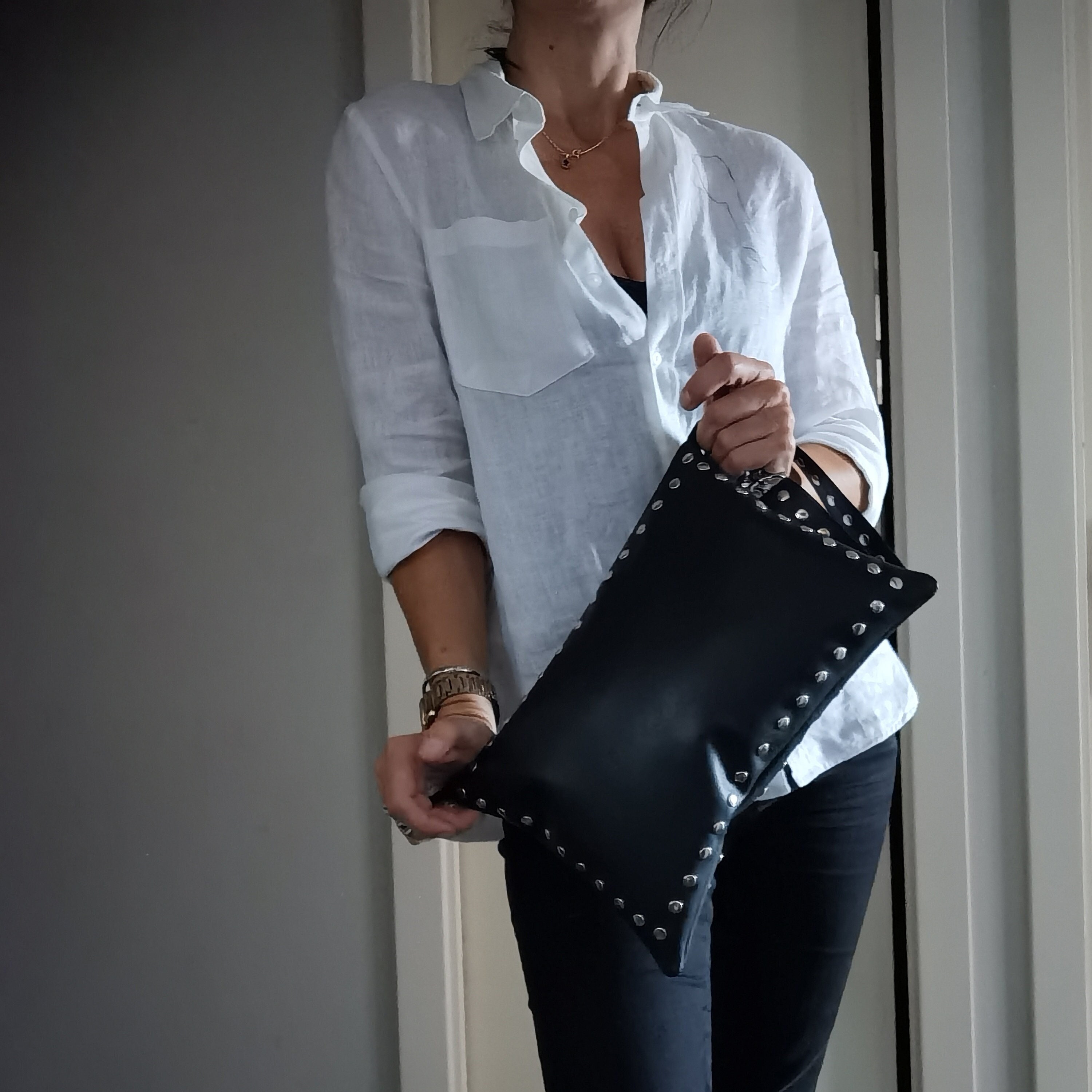 Rivo Studded bucket bag with shoulder strap in cowhide leather