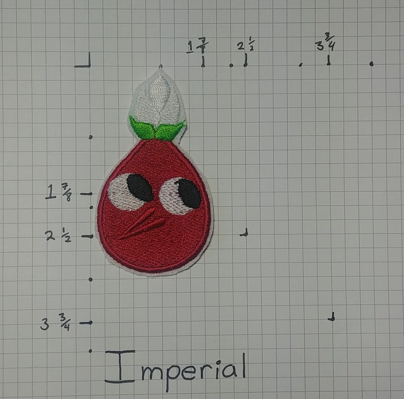 May include: Red embroidered patch of a cartoon character with large eyes, a red body, green leaves, and a white flower on top. The character has a small mouth and a red nose. The patch is labeled "Imperial".