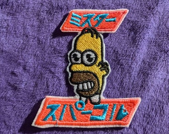 Parche termoadhesivo de 85 mm de Mr. Sparkle Simpson