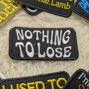 Nothing to lose 90mm iron on patch