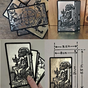 May include: Five silver tarot cards with black embroidery. The cards are Queen of Cups, Wheel of Fortune, Page of Wands, and Ace of Wands. The cards are 3.1 inches wide and 5.5 inches tall.